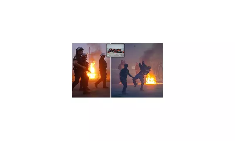 Chaos in Calais: Riot Police Clash with Migrants as Small Boat Heads to Britain