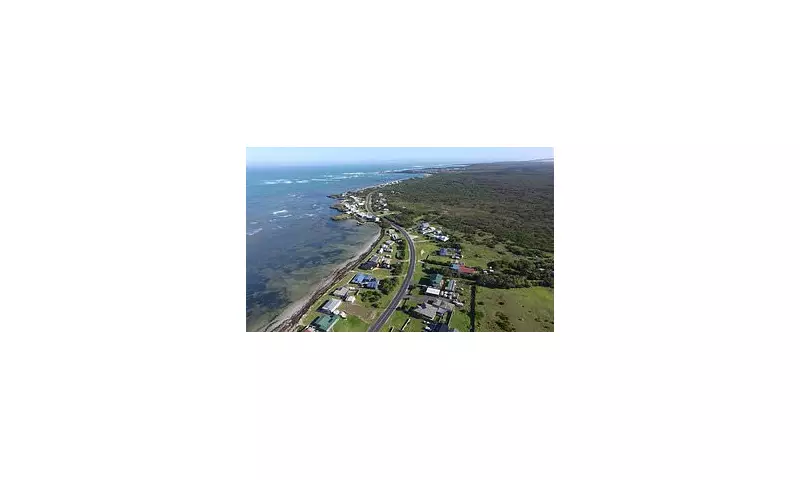 Pelican Point Beachside Town Faces Coastal Crisis as Ocean Erosion Threatens Homes