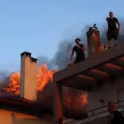 Greece Wildfires: Tourists and Locals Flee as Flames Engulf Rhodes and Corfu