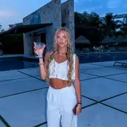 Princess Andre Stuns in White Swimsuit as She Soaks Up the Sun on Luxury Holiday