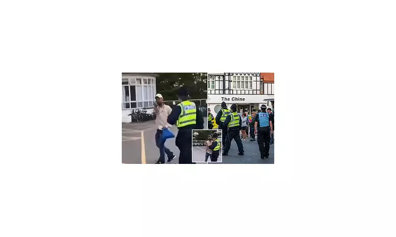 Asylum Seeker Flips Off Protesters Outside UK Migrant Hotel in Defiant Gesture