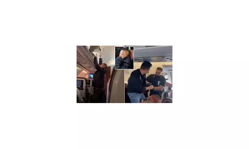 Passenger Slaps Thief Mid-Flight After Catching Him Stealing from Overhead Cabin