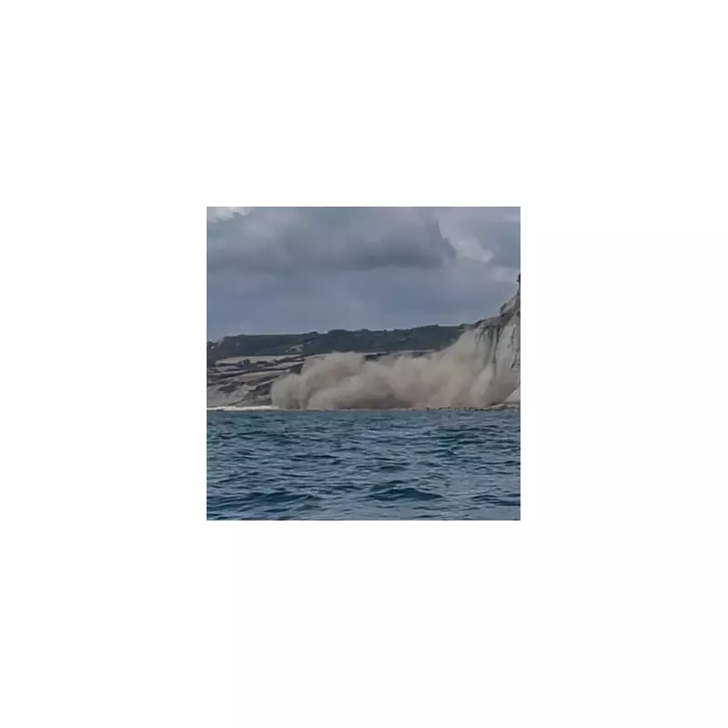Shocking Moment Cliff Collapses Onto Beach in Front of Startled Sunbathers in Dorset