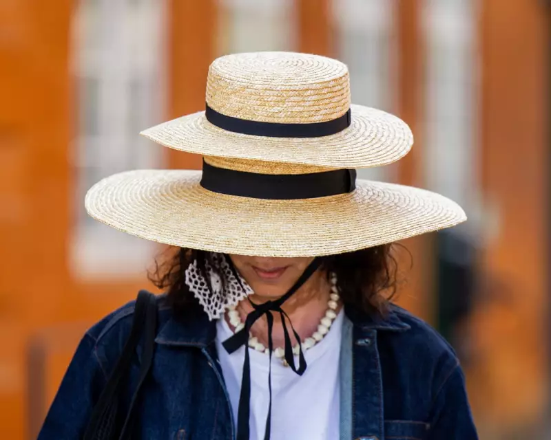 Striking Images of the Day: A Double Hat and a Tbilisi Monument