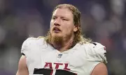 Atlanta Falcons Blow: Star Tackle Kaleb McGary Sidelined with Devastating Knee Injury