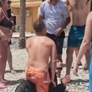 Dramatic Footage Shows Migrants Detained on Spanish Beach After Desperate Crossing