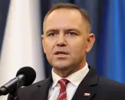 Poland's President Vetoes Extension of Ukrainian Refugee Benefits, Sparking Tension | The Guardian