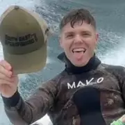 Shark Attack Survivor's Harrowing Ordeal: 'I Saw My Leg Hanging Off'