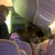 Shocking Moment Unruly Emirates Passenger Restrained Mid-Flight to London After 'Trying to Open Door'
