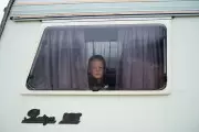 A Boy's Quiet Contemplation: Award-Winning Photo Captures Childhood Wonder from a Caravan Window