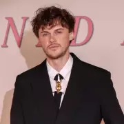 Chris Briney's Awkward 'Summer I Turned Pretty' Quiz Fail Goes Viral | Exclusive