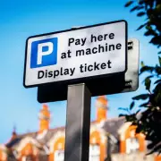 UK Drivers Face £200 Fine and Points for Using Phone While Paying at Drive-Thrus or Car Parks