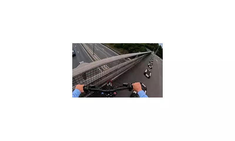 Daredevil E-Bike Rider Sparks Motorway Mayhem: Shocking Footage Shows Reckless Bridge Stunt