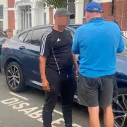 BMW Driver Sparks Fury After Stealing Disabled Parking Space in Shocking CCTV Footage