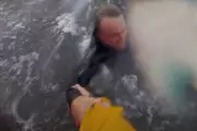 RNLI Lifeguards Execute Daring Surf Rescue as Swimmer Battles Treacherous Rip Current