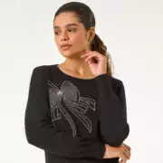 Sparkle This Christmas: Roman's £25 Bow Jumper Sells Out in Hours as Must-Have Festive Fashion