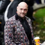 Tyson Fury Dons Sharp Suit for Ricky Hatton's Pub Opening in Emotional Manchester Reunion