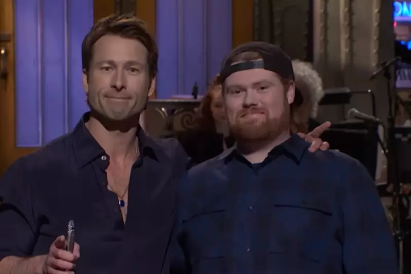 Glen Powell Brings UPS Driver to SNL Debut After Four-Year Promise