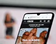 Asos narrows losses to £282m as AI stylists target fashion revival