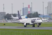 LOT Polish Airlines plane slides off runway at Vilnius airport in snow