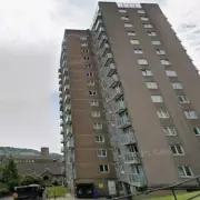 Man, 25, seriously injured in tower block fall, police arrest suspect