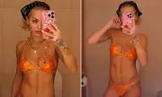 Rita Ora Shows Off Incredible Washboard Abs in Daring Orange Bikini During London Return