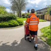 Royal Mail postman's hilarious window delivery with cleaner's help