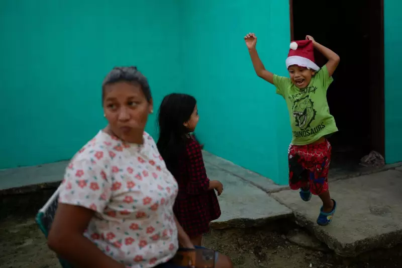 AP's Top Photos: Venezuelan Migrants' Christmas and Bolivian Climber in Pollera