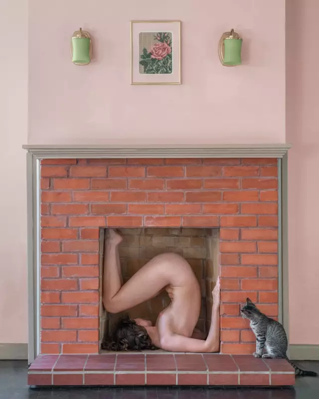 Artist's Nude Fireplace Self-Portrait with Stray Kitten Captivates Social Media