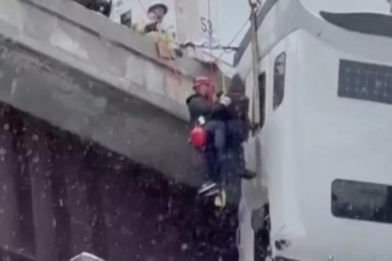 West Virginia Truck Driver Rescued After Hours Dangling From Icy Bridge