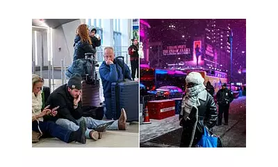 Northeast US buried by severe snowstorm as California reels from deadly floods