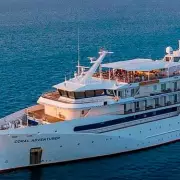 Cruise Ship Coral Adventurer Evacuated After Hitting Reef in Troubled Voyage