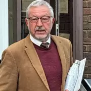 Ex-teacher jailed for 'vicious' guttering row attack on neighbour