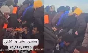 Exclusive: Migrants Use Nike Trainers to Bail Out Sinking Channel Boat