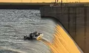 Four Men Cling to Boat at 130ft Dam Edge in South African Rescue Drama