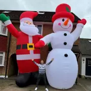 Furious neighbour slams 20ft inflatable Santas as 'cheap and tacky' in anonymous letter