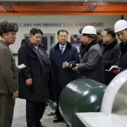 Kim Jong-un unveils nuclear submarine and issues stark war warning