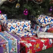 Last-Minute Christmas Wrapping Hack Uses Ironing Board, Broom & Hangers