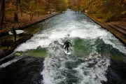 Munich's Eisbach Wave War: Surfers' Covert Beam Removed by Fire Crew