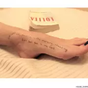 New Epstein Photo Shows 'Lolita' Writing on Woman's Body