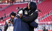 Simone Biles Swaps VIP Suite for Sideline as NFL Guest Photographer
