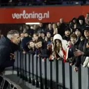 Van Persie leaps over boards to confront furious fans after Feyenoord's 8th loss