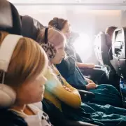 Woman's flight envy as kids lie down in seats - 'practically first class'