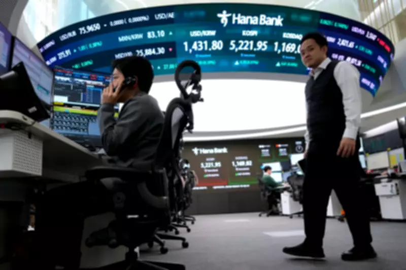Asian Markets Mostly Lower Following Wall Street's Dramatic Swings and Microsoft's Sharp Drop