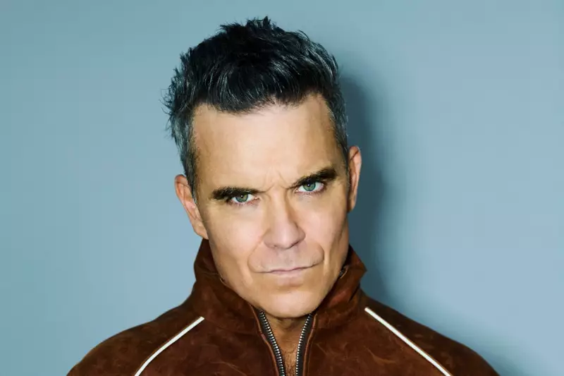 Robbie Williams Surpasses The Beatles With Historic 16th UK Number One Album
