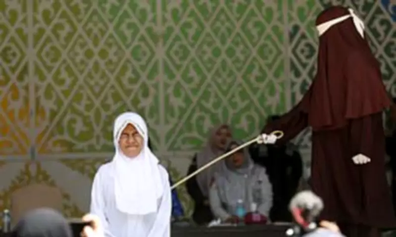 Woman Collapses After 140-Stroke Caning for Sex and Drinking in Aceh