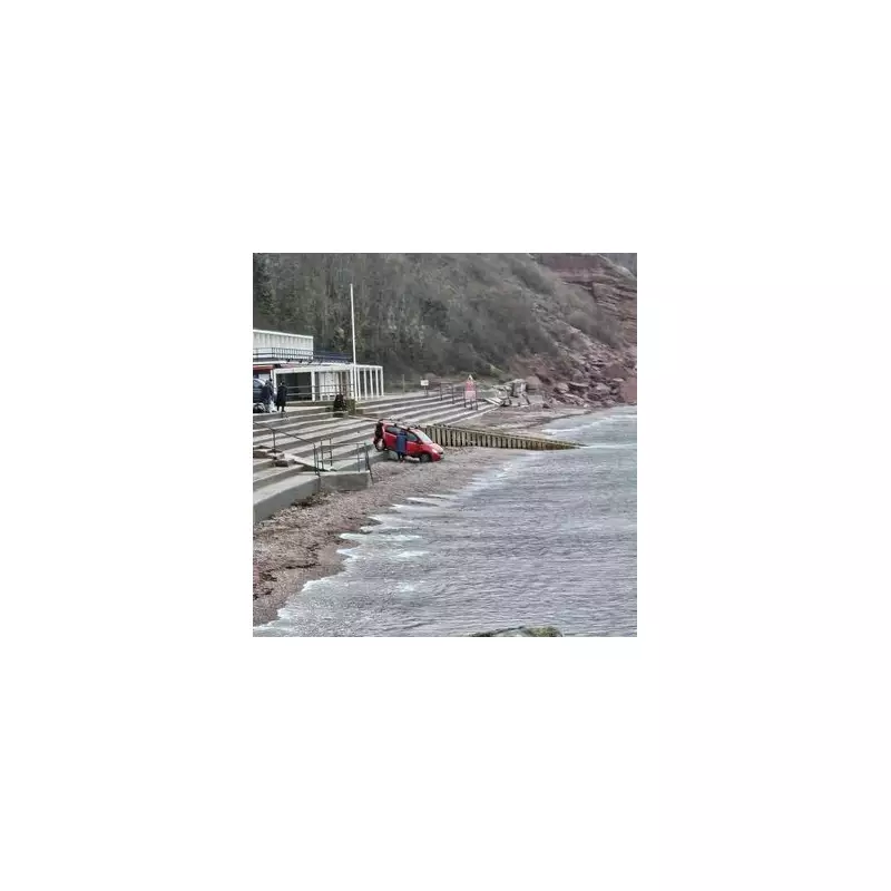 Woman Unhurt as Car Rolls Down Steps onto Devon Beach, Stopping Near Sea