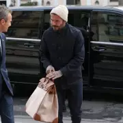 David Beckham's Paris Fashion Week Outing with Sons Amidst Brooklyn's Family Feud