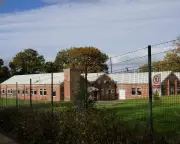 First Asylum Seekers Arrive at East Sussex Barracks Amid Protests and Legal Challenges