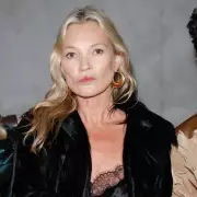 Kate Moss Radiates Charm at YSL Menswear Show During Paris Fashion Week